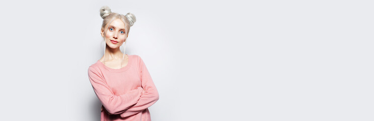 Portrait of pretty blonde girl with crossed arms. Panoramic banner, copy space.