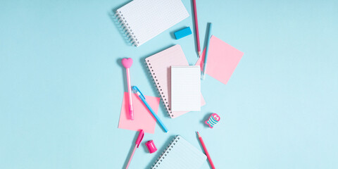 Back to school concept. School accessories on  blue background. Flat lay, top view, copy space