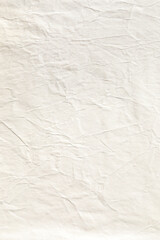 Vertical light brown crumpled paper background texture