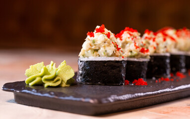 japanese rice rolls with red caviar close-up