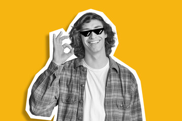 Cool guy with long hair showing okay over yellow background