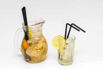 Splash of Refreshing Icy Drink With Glass and Biodegradable Straws made of potato peel Isolated on White