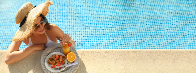 Young woman with delicious breakfast in swimming pool, banner design