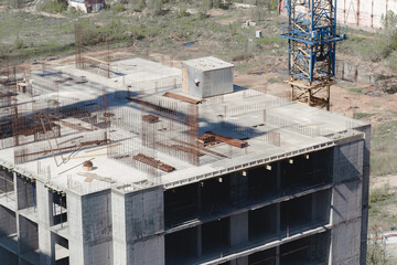 crane at construction site panorama of city. unfinished building, building under construction. panorama of city, construction of high-rise building russia