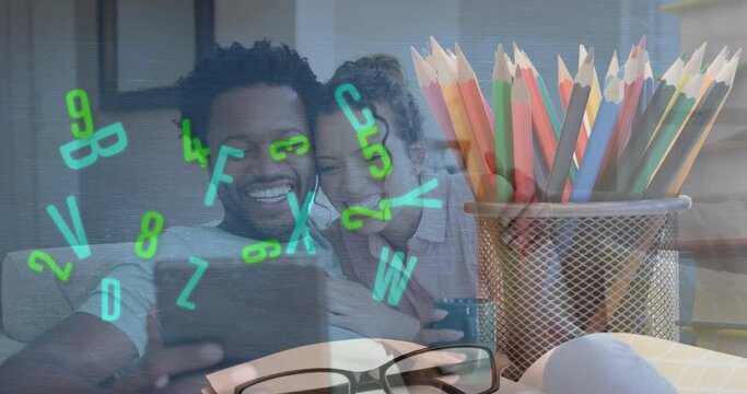 Animation of colourful pencils over african american couple using tablet