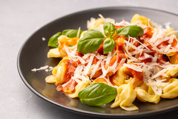 Italian tortellini pasta with tomato sauce - Italian food style - obrazy, fototapety, plakaty