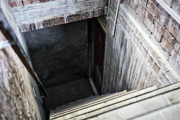 All the bricks and stairs of the damp basement were covered with salt and mold. A room that has not been ventilated or cleaned.