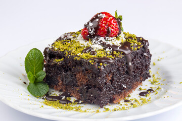 Chocolate moist cake. Wet cake in a plate. Bakery products. (Turkish name; islak kek)