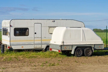 Old mobile home trailer house camper and cargo trailer. close up