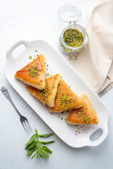 Traditional Turkish desserts; custard triangular dessert, albanian dessert ( Turkish name; Arnavut tatlisi or muhallebili muska tatlisi)