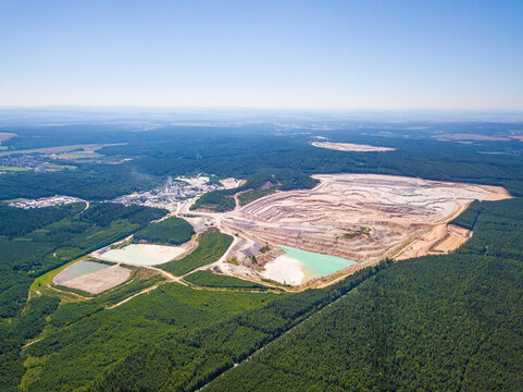 Aerial view of large kaolin open pit mine for ceramics production. Industrial area from above. Kaznejov, Czech republic, European union.