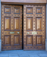big old wooden door open in town