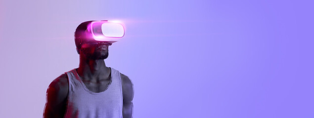 Fit guy wearing VR headset, exercising with virtual reality gear