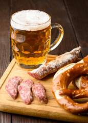 traditional mug of beer, pretzels and fuet sausage