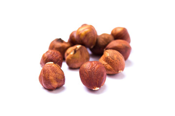 hazelnuts lie on a white background