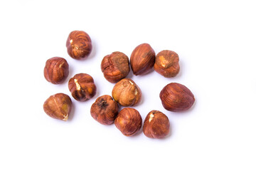 hazelnuts lie on a white background