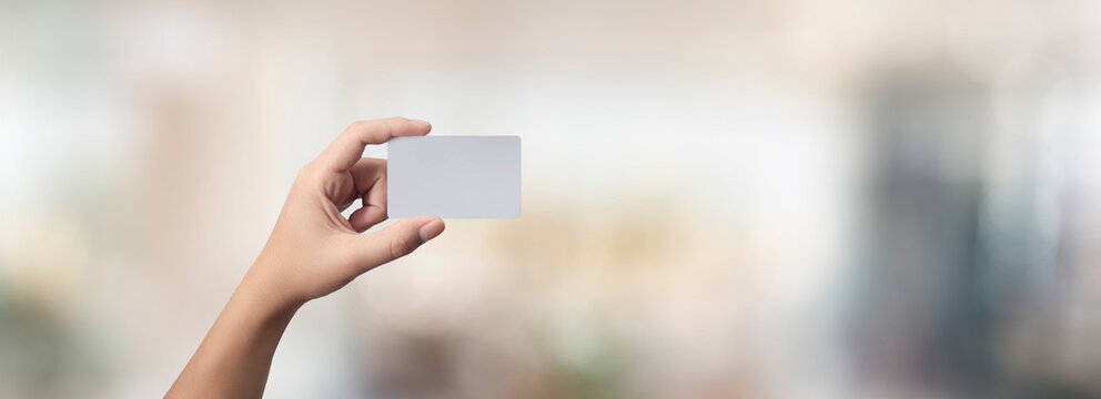 man holding a credit, debit/business card in his hands - easy modification