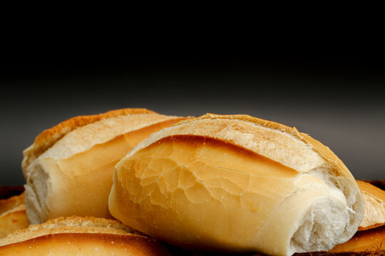 Portion of french bread on black background