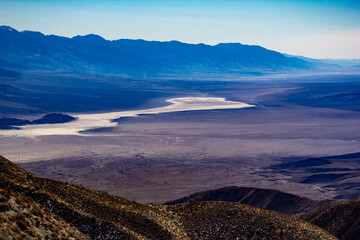 view of mountains and dried river bed in death valley