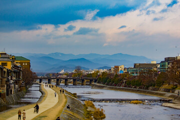 view of mountains and river through a city