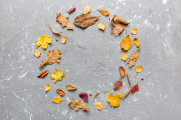 Autumn composition made of dried leaves, cones and acorns on table. Flat lay, top view, copy space