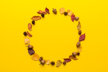 Autumn composition made of dried leaves, cones and acorns on table. Flat lay, top view