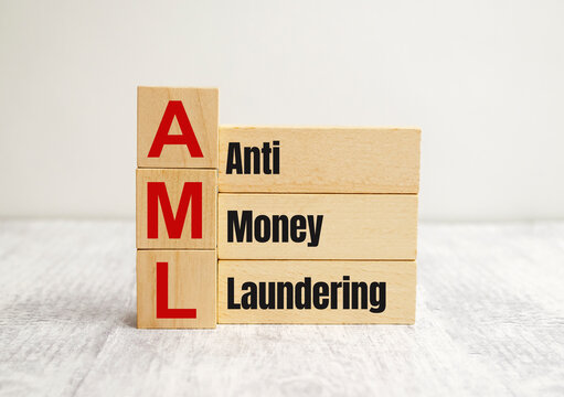 On the wooden blocks with the inscription - AML Anti-Money Laundering