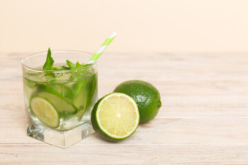 Mojito cocktail. Refreshing mojito cocktail with lime, lemon and mint in a tall glass with a stick