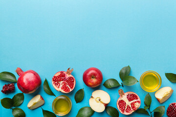 Flat lay composition with symbols jewish Rosh Hashanah holiday attributes on colored background,...