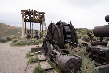 Fototapeta na wymiar Antique Mining Town In Bodie State Historic Park. Vintage Buildings And Old Mining Equipment Still Standing In Good Condition.