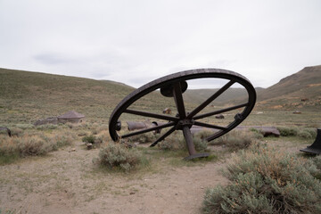 Fototapeta premium Antique Mining Town In Bodie State Historic Park. Vintage Buildings And Old Mining Equipment Still Standing In Good Condition.