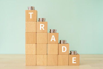 貿易・商売・トレードのイメージ｜「TRADE」と書かれたブロックとコイン
