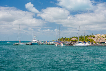 Port with sailboats and ships in Isla Mujeres island in Caribbean Sea, Cancun, Yucatan, Mexico