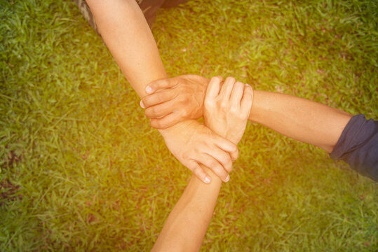 Close Up Three Hands Diverse Multiethnic Partner Team Together. Teamwork Group Of Multiracial People Meeting Join Hands Together. Diversity People Hand Join Empower Partner Team Trust Team Solidarity