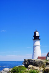Fototapeta na wymiar Portland, Maine, USA - 07 03 2022: The Portland Head Lighthouse in Cape Elizabeth, Maine, USA