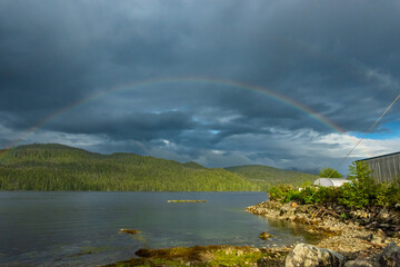 A rainbow over McLoughlin Bay where B.C. Ferries dock for the town of Bella Bella on the Inland Passage up British Columbia's Central Coast.  Room for text.
