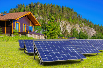 Solar panels near country house. Eco friendly technology. Power plant. Solar panels in picturesque location. Alternative source energy. Solar technology panels. IVF Eco modules. Private power station - obrazy, fototapety, plakaty