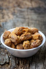 Indian dry dates in white bowl