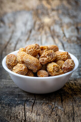 Indian dry dates in white bowl