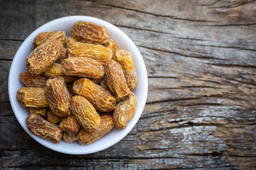 Indian dry dates in white bowl