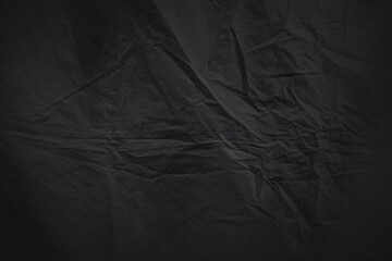 abstract wrinkled black surface sheet material background backdrop