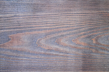 Fototapeta na wymiar Wood grain texture background. Reddish wooden surface close up.
