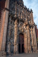 Baroque Architectural Style Facade detail-adorned with decorations-of the southern façade of the Metropolitan Cathedral, opening out towards the Zócalo Plaza in Mexico City, Mexico.