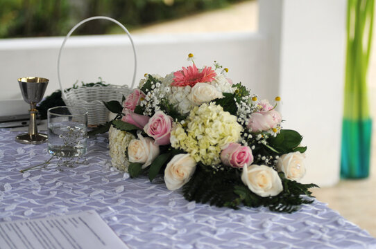 Wedding presidium in restaurant, free space. Wedding banquet table for newlyweds with flowers