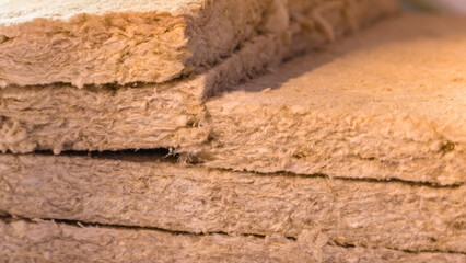 Easy-to-use green glass wool close-up. cut of mineral wool