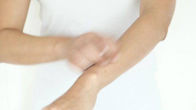 The man's hands he uses his hands to scratch his back because of dermatitis and itch sensation.