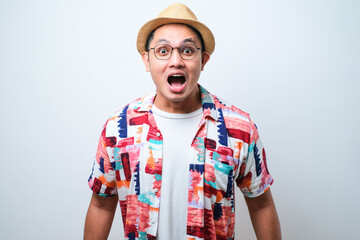 Young handsome man afraid and shocked, surprise and amazed expression