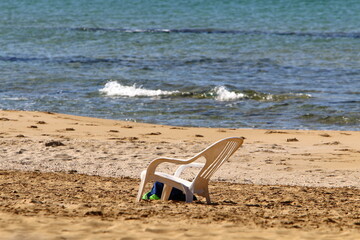 Fototapeta na wymiar Chair on the Mediterranean Sea