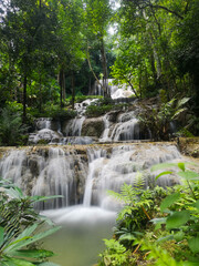 Fototapeta na wymiar Mae Kae waterfall, limestone waterfall at Lampang province in Thailand
