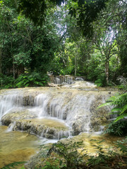 Fototapeta na wymiar Kao Fu or Mae Kae 2 waterfall, limestone waterfall at Lampang province in Thailand